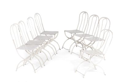 six white folding chairs with a white table and four white chairs