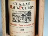 a bottle of wine in a wooden box on a table