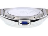 a close up of a watch on a white surface