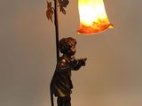 an image of a lamp that is on a table next to a lamp
