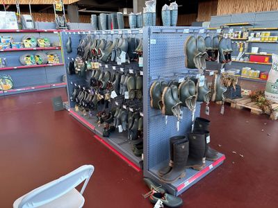 a large display of hats and other items in a store