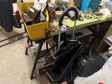 a cluttered workbench with a lot of clutter on it