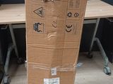a cardboard box sitting on top of a wooden table