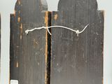 three pieces of wood that have been painted black