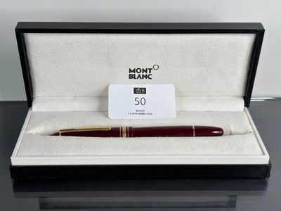 a close up of a pen in a box on a table