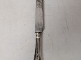 a knife that is laying on a table