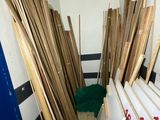 many pieces of wood stacked up in a room