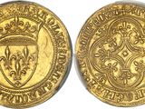 two gold sovereigns, one of which has a crown and the other of which is a shield