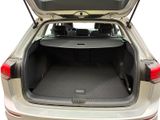 the back of a car with the trunk open and the back seats folded down