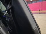 a close up of a seat in a car with a key in it
