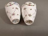 two salt and pepper shakers on a table