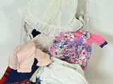 a pile of clothes that is sitting on the floor