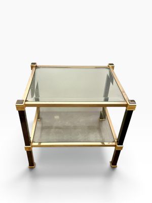 a brass and glass coffee table
