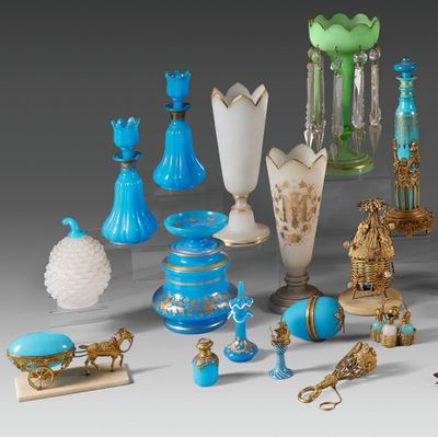many different types of glass vases on the table