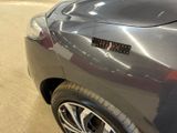 a close up of a car with a sticker on it ' s hood