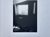 an image of a black and white photo of a room with a window