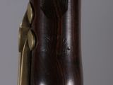 a close up of a wooden object with a metal handle
