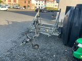 a small trailer that is parked in a parking lot
