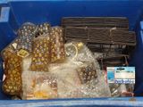 a blue bin filled with assorted items in it
