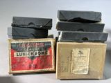 three boxes of luncheone are stacked on top of each other