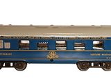 a blue train car that is sitting on the tracks
