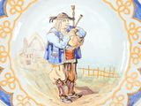 a plate with a picture of a man playing a bagpipe