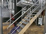 a metal staircase going up to the top of a building