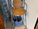 a wicker chair in the corner of a room