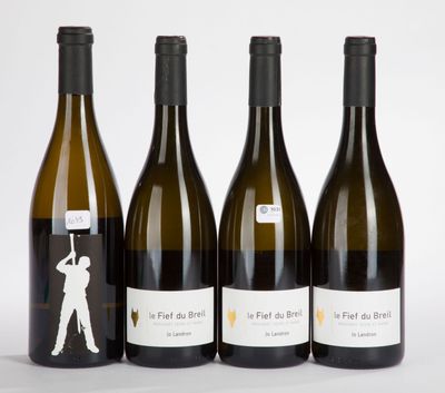 four bottles of wine are lined up on a white surface