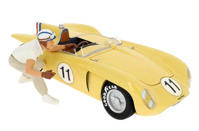 a figurine of a man in a racing car