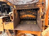 a picture of a machine that is sitting in the dirt