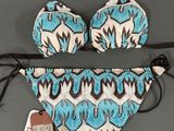 a bathing suit with a blue and white pattern on it