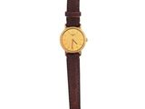 a close up of a watch on a white surface with a white background