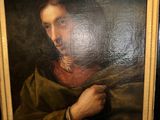 an oil painting of a man holding a piece of wood