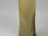 a vase that has a picture of a tree on it