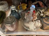 a table with a lot of dishes and cups on it