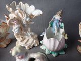 many figurines of different shapes and sizes on the table