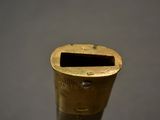 a close up of a metal object with a hole in it