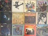 a lot of records that are on the floor