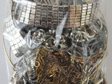a bag of assorted metal items inside of a plastic bag