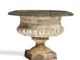 a stone vase on a pedestal on a white background
