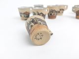 six wine corks that are sitting on a table