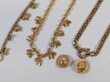 a lot of gold necklaces and bracelets on the table