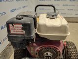 a lawn mower that is sitting on the ground
