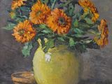 painting of yellow flowers in a green vase on a table