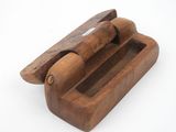 an old wooden box with a wooden handle on a white surface