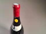 a bottle of wine that is sitting on a table
