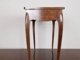 an image of a small wooden table on a hard wood floor