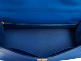 the inside of a blue handbag with a zipper on it