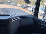 a view of a parking lot from inside of a truck